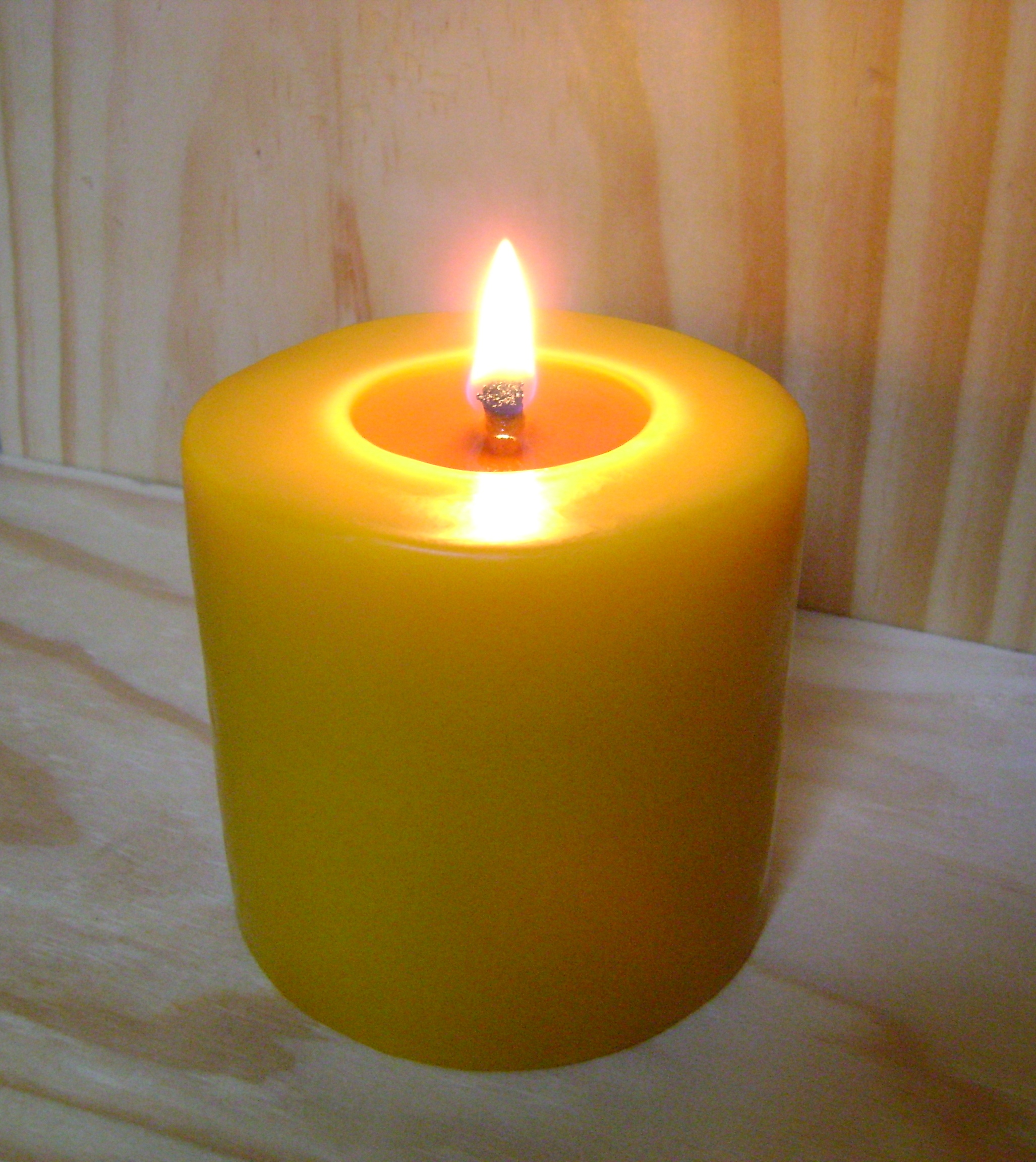 Image of a candle on the Altar