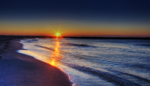 Image of a sunrise over a beach